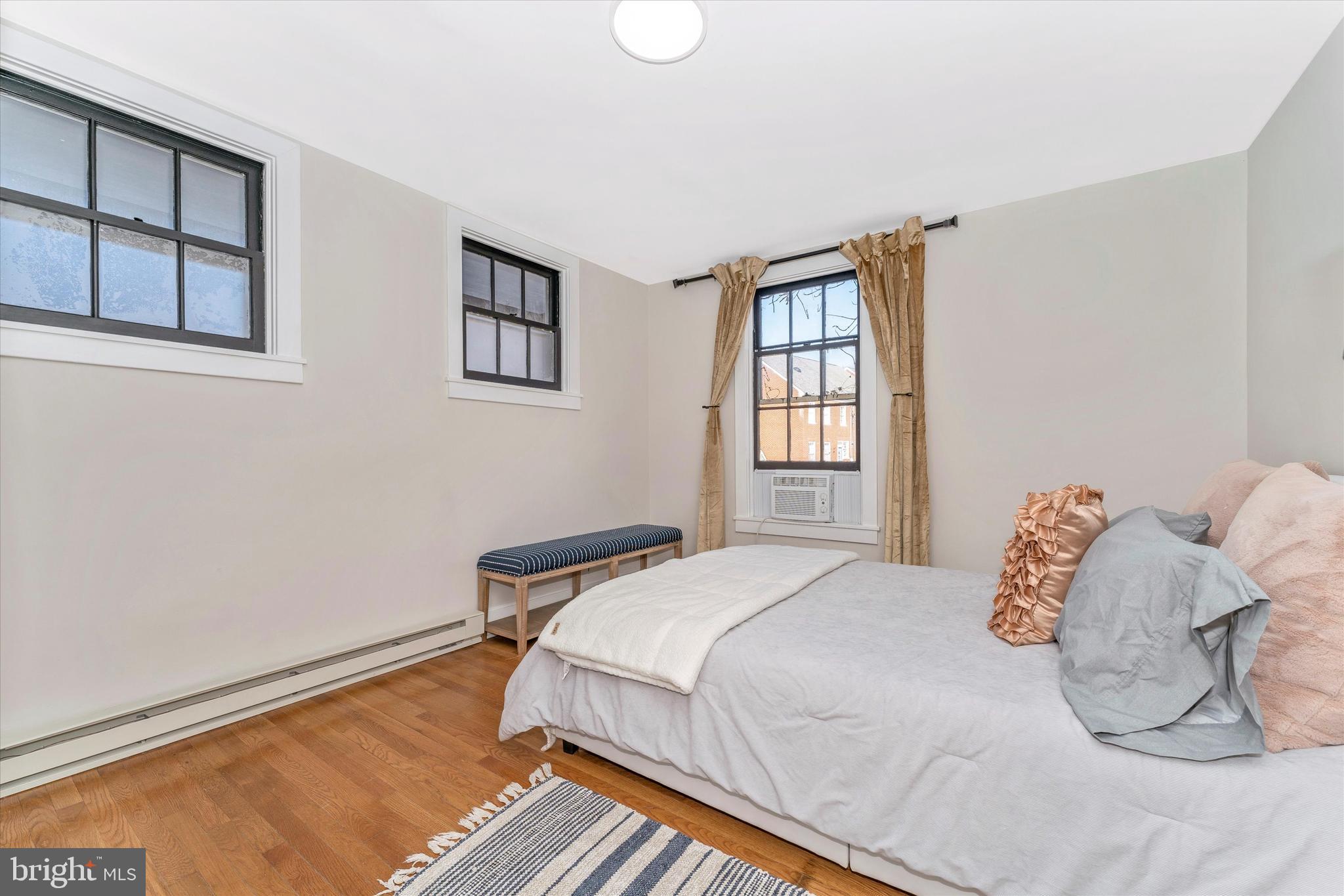 125 West Church Street, Unit B Frederick, MD 21701 - Photo 21 of 60 a bedroom with a bed and a window