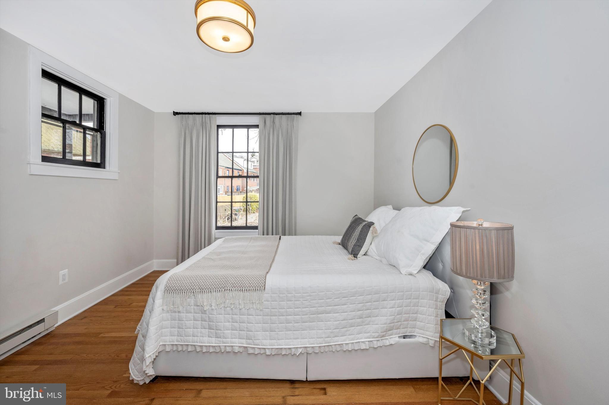125 West Church Street, Unit B Frederick, MD 21701 - Photo 22 of 60 a bedroom with a bed and a window