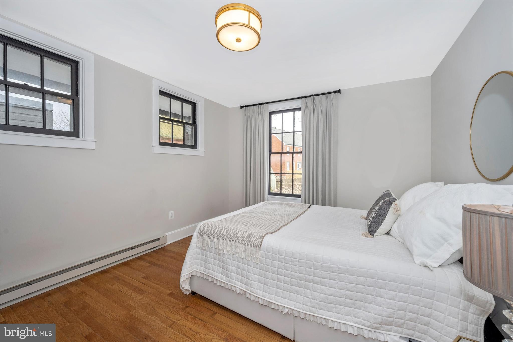 125 West Church Street, Unit B Frederick, MD 21701 - Photo 23 of 60 a bedroom with a bed and a window