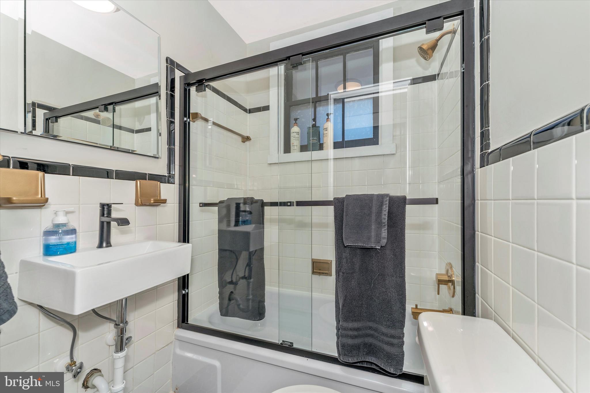 125 West Church Street, Unit B Frederick, MD 21701 - Photo 28 of 60 a bathroom with a sink and mirror