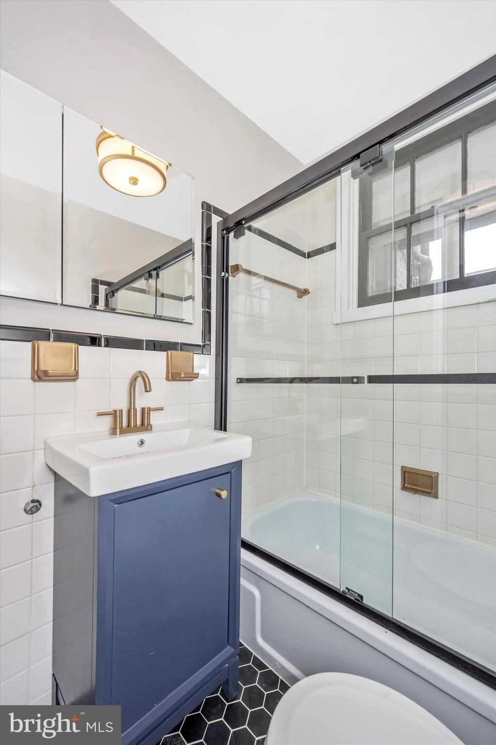 125 West Church Street, Unit B Frederick, MD 21701 - Photo 30 of 60 a bathroom with a sink and a mirror