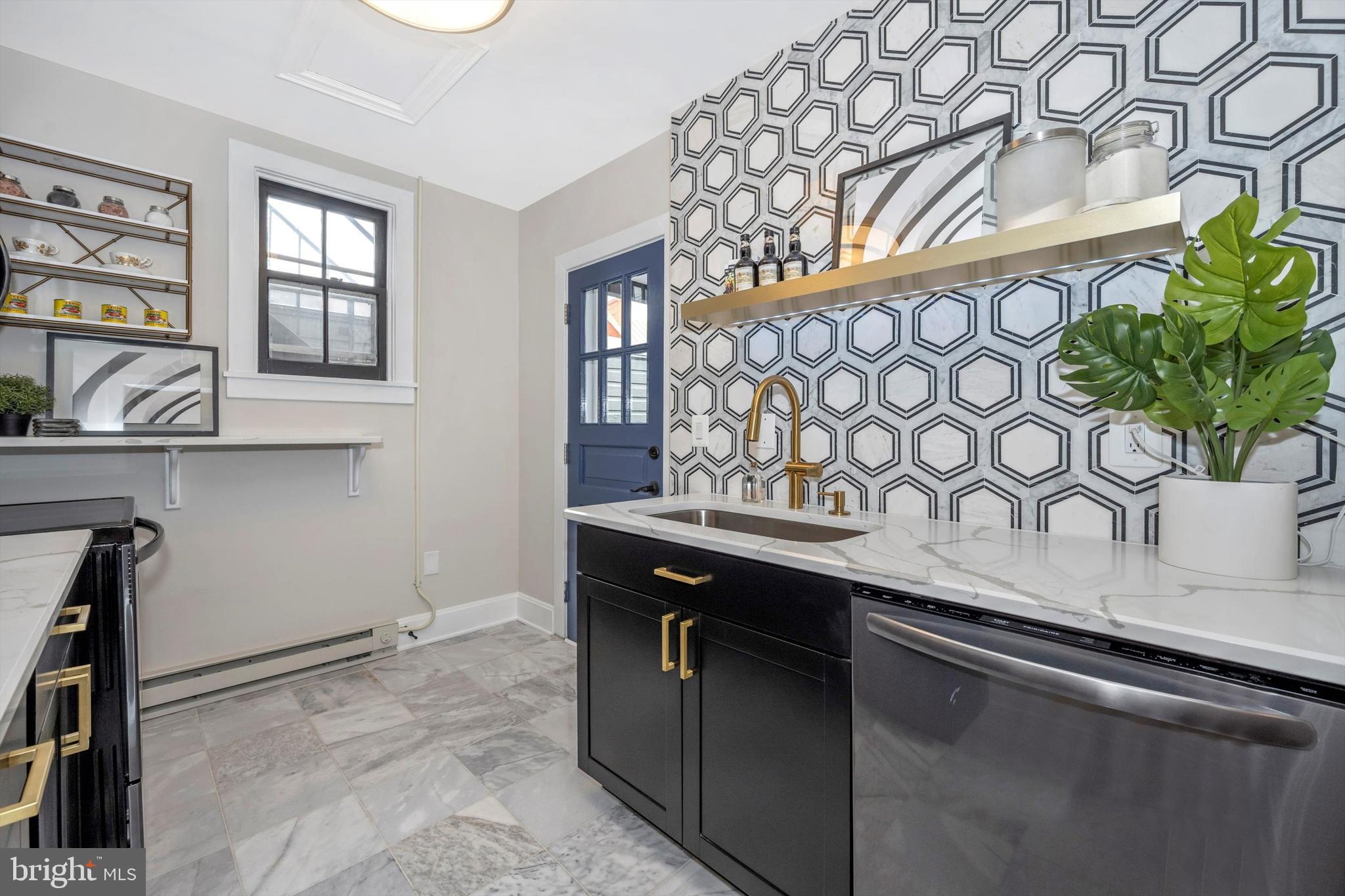 125 West Church Street, Unit B Frederick, MD 21701 - Photo 34 of 60 a kitchen with a sink and cabinets