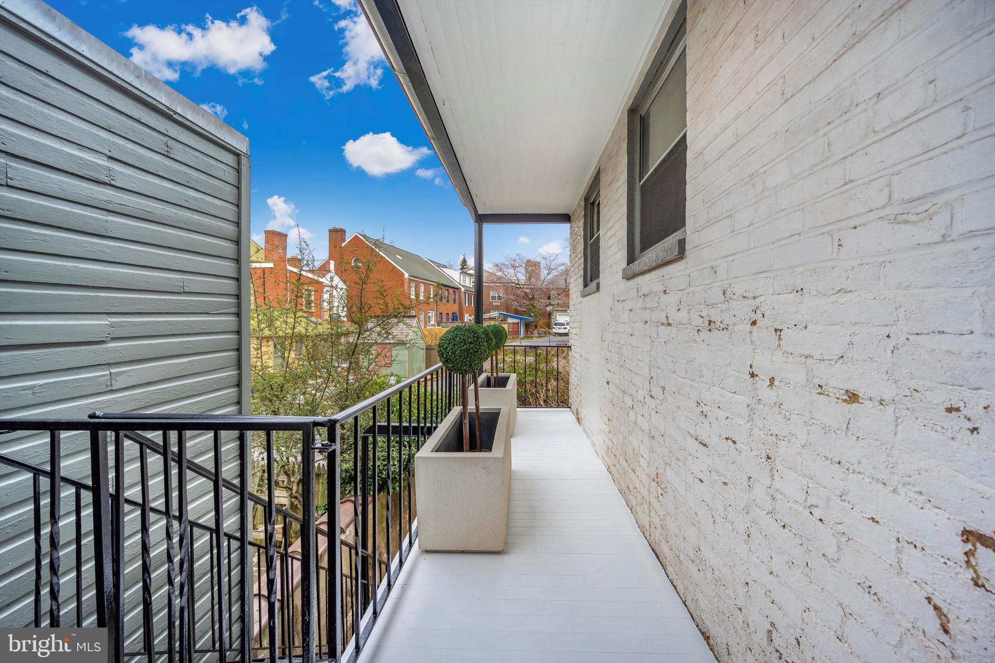 125 West Church Street, Unit B Frederick, MD 21701 - Photo 48 of 60 a view of a balcony with wooden floor