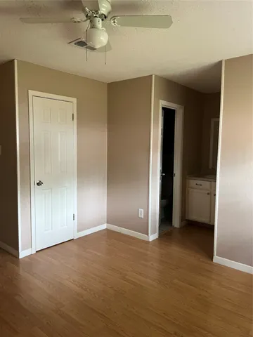 a view of an empty room with a bathroom