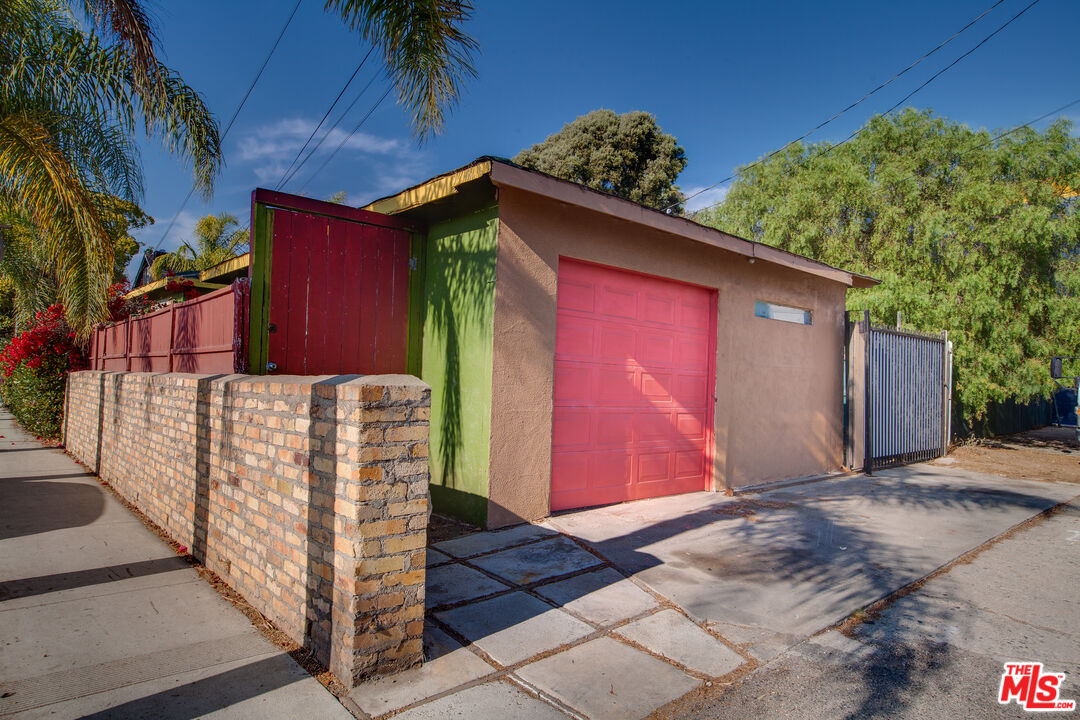 802 Superba Avenue Venice, CA 90291 - Photo 9 of 16 a view of a house with a wooden fence