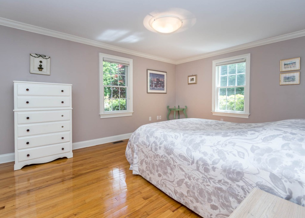 65 Avalon Road Needham, MA 02492 - Photo 19 of 30 a bedroom with a bed and a window
