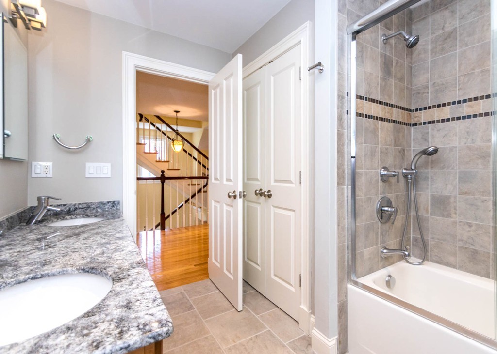 65 Avalon Road Needham, MA 02492 - Photo 21 of 30 a bathroom with a granite countertop sink mirror and a bathtub