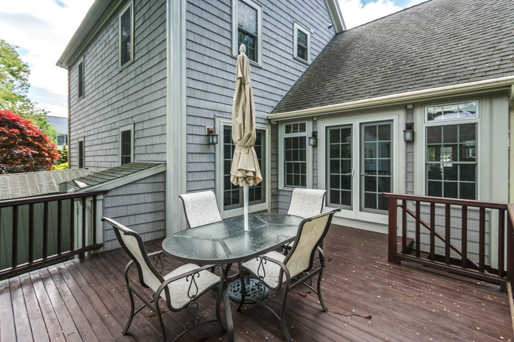 65 Avalon Road Needham, MA 02492 - Photo 27 of 30 a view of a patio with a table and chairs