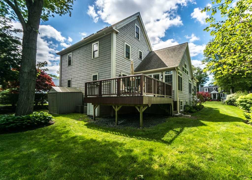 65 Avalon Road Needham, MA 02492 - Photo 28 of 30 a view of a house with a yard and sitting area