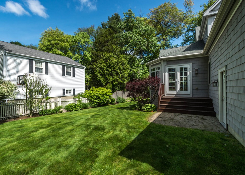 65 Avalon Road Needham, MA 02492 - Photo 30 of 30 a view of a house with a yard and sitting area