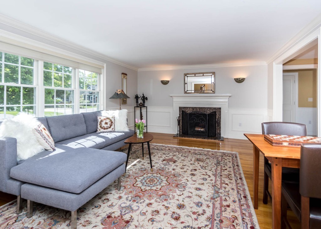 65 Avalon Road Needham, MA 02492 - Photo 3 of 30 a living room with furniture and a fireplace