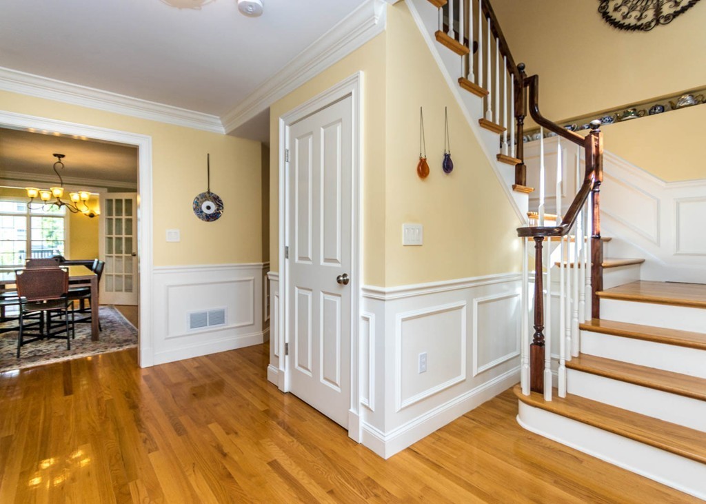65 Avalon Road Needham, MA 02492 - Photo 7 of 30 a view of a hallway with wooden floor and staircase