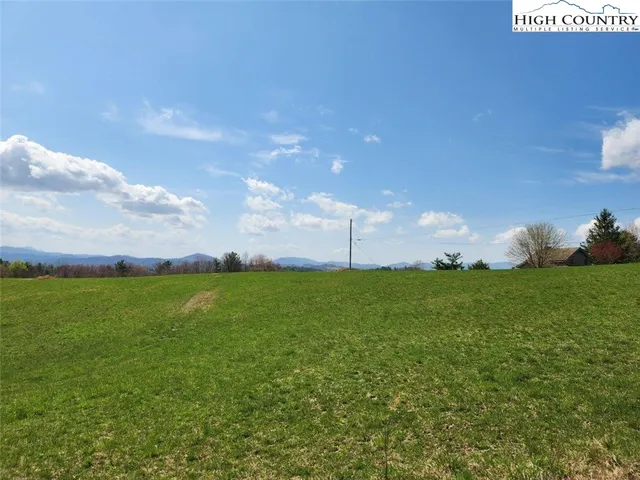 a view of a green field with clear sky
