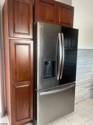 a kitchen with stainless steel appliances granite countertop a sink and a stove