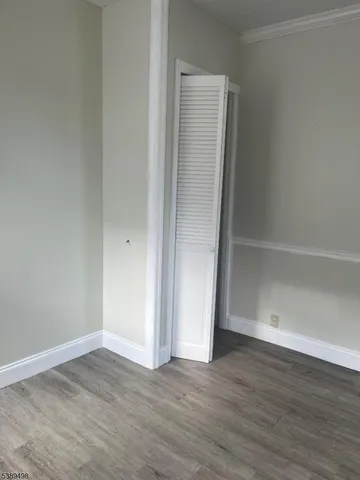 a white toilet sitting next to a bath tub