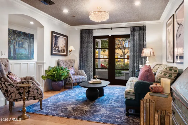 a living room with furniture potted plant and a window