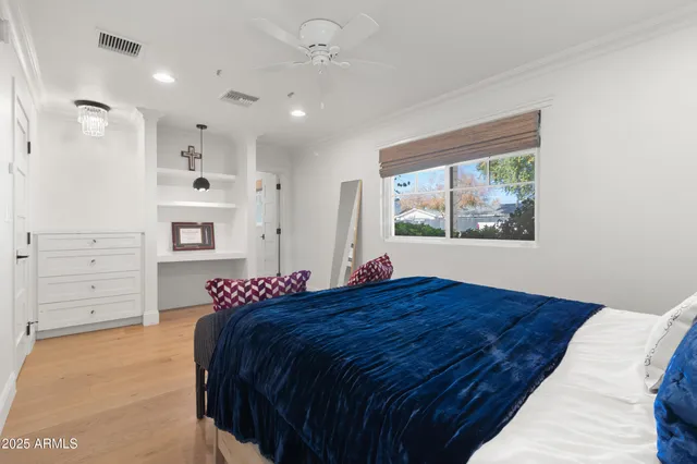 a bed room with a bed and a window