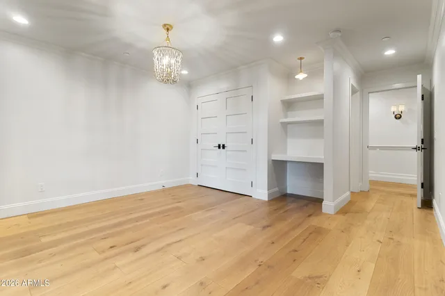 a view of an empty room with a kitchen