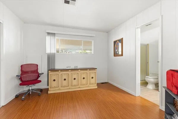 a room with furniture and wooden floor