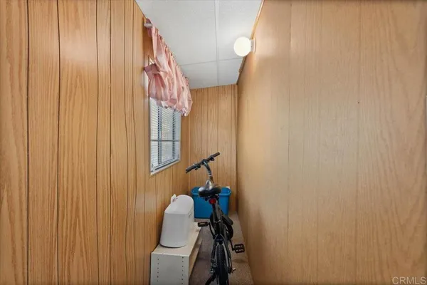 a view of a hallway with paintings on the wall
