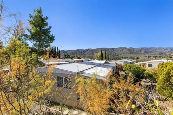 a view of a swimming pool with a yard