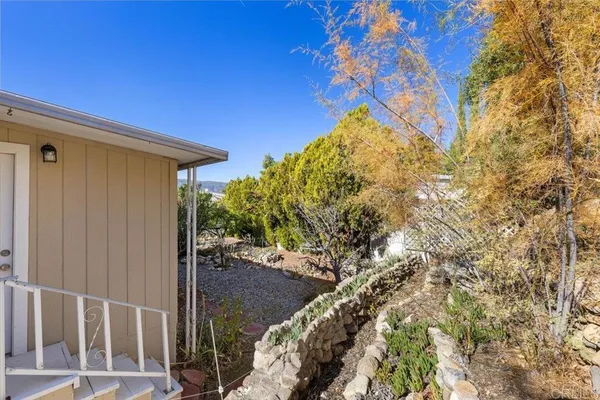 a backyard of a house with lots of green space