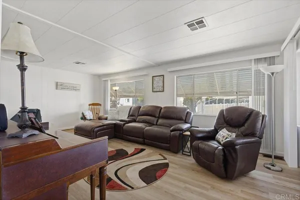 a living room with furniture and a window