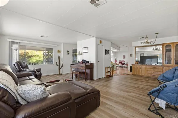 a living room with furniture or couch and a wooden floor