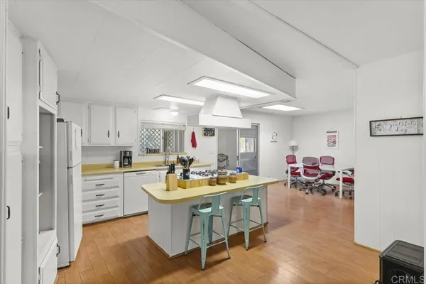 a very nice looking kitchen with a table and chairs