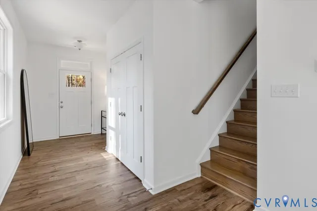 a view of entryway with wooden floor
