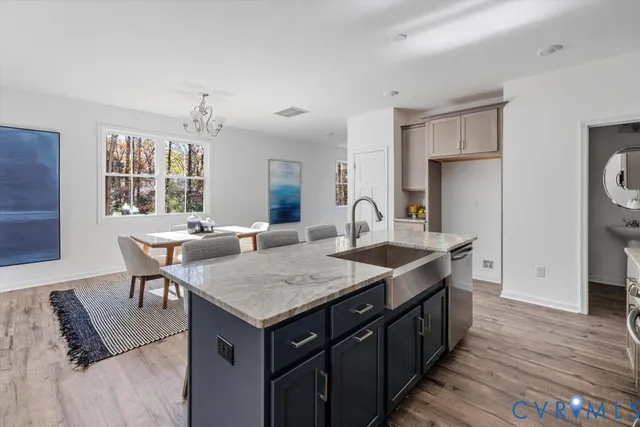 a kitchen with a stove a sink and a refrigerator