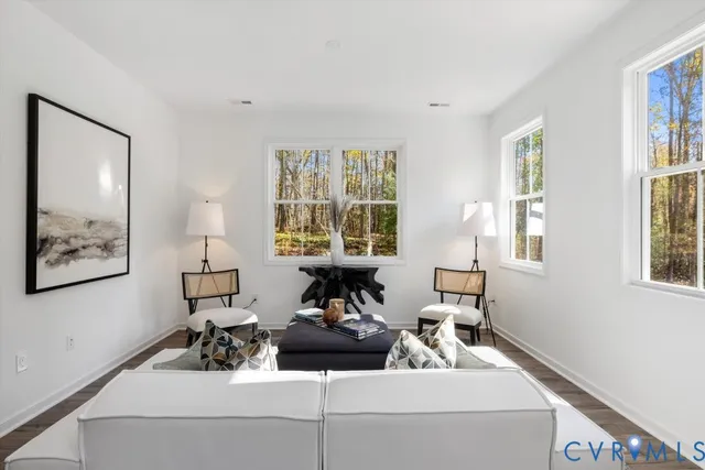a living room with furniture and window