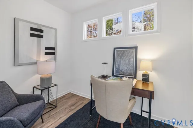 a workspace with furniture and wooden floor