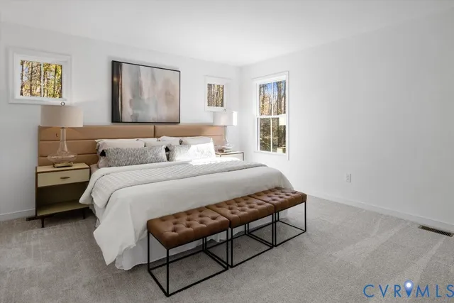 a bedroom with a bed and a night stand