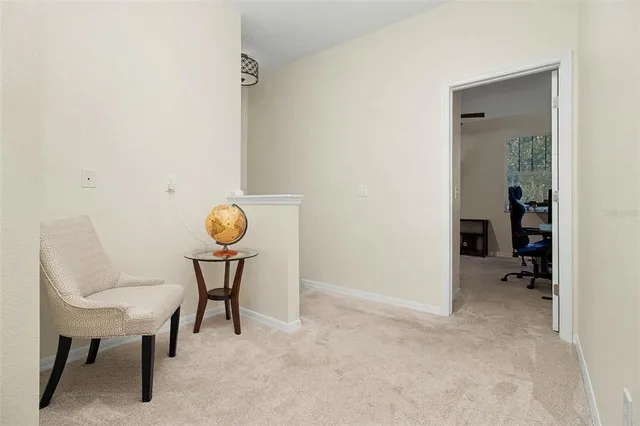 a view of a room that has a table and chairs in it