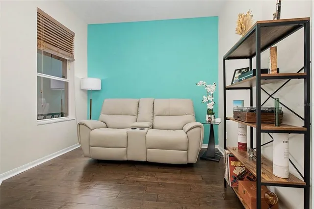 a living room with furniture and a window