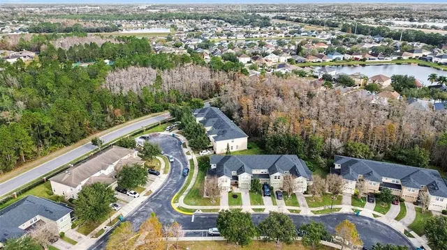 an aerial view of residential house with outdoor space and river