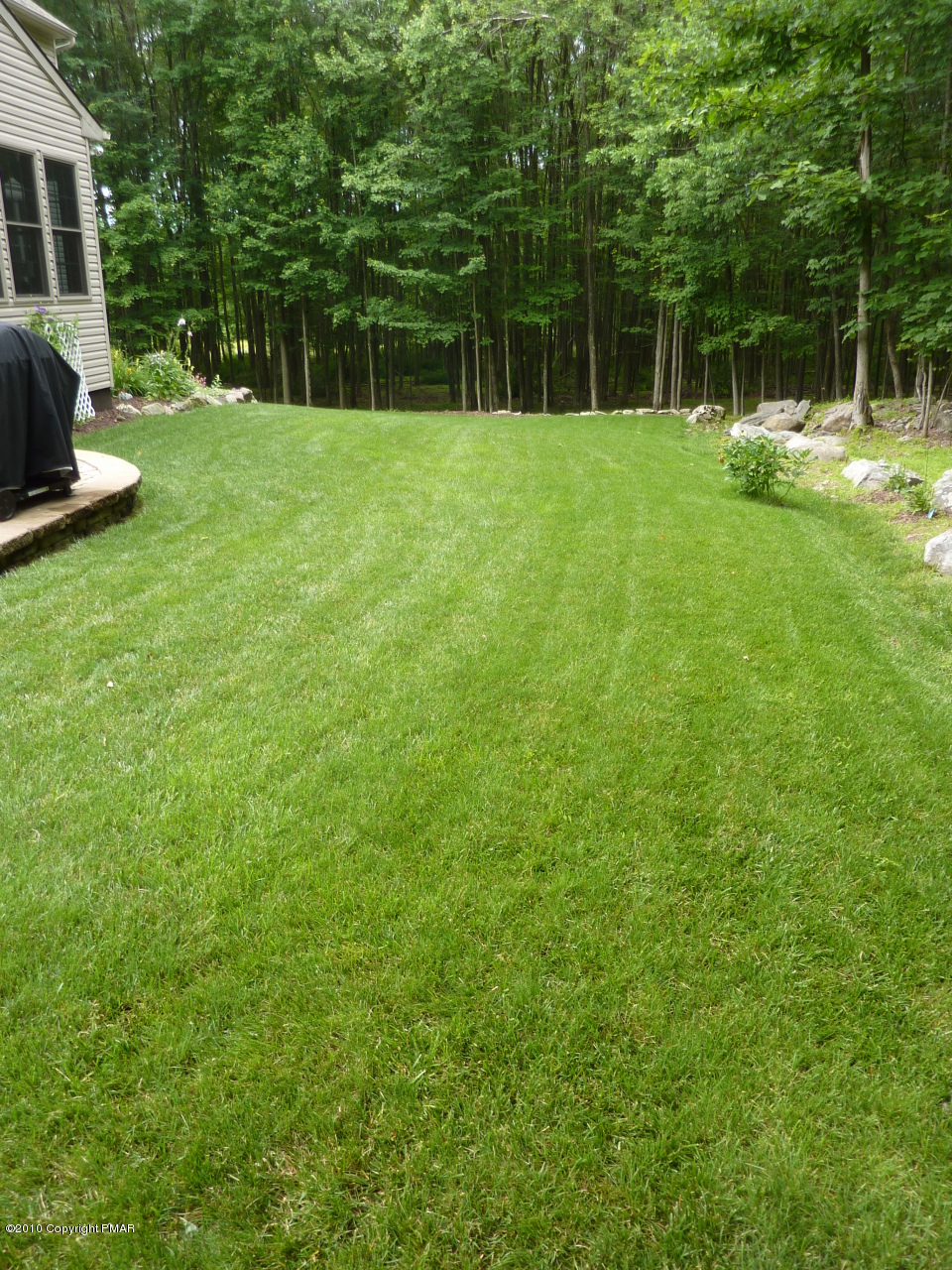 107 Fox Chase Road Stroudsburg, PA 18360 - Photo 25 of 28 a view of backyard with a garden and entertaining space