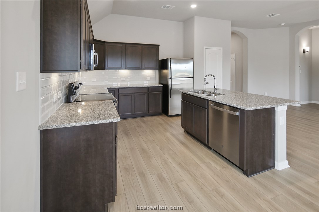 10603 Natural Pond Road College Station, TX 77845 - Photo 10 of 33 large kitchen with lots of countertop space and storage