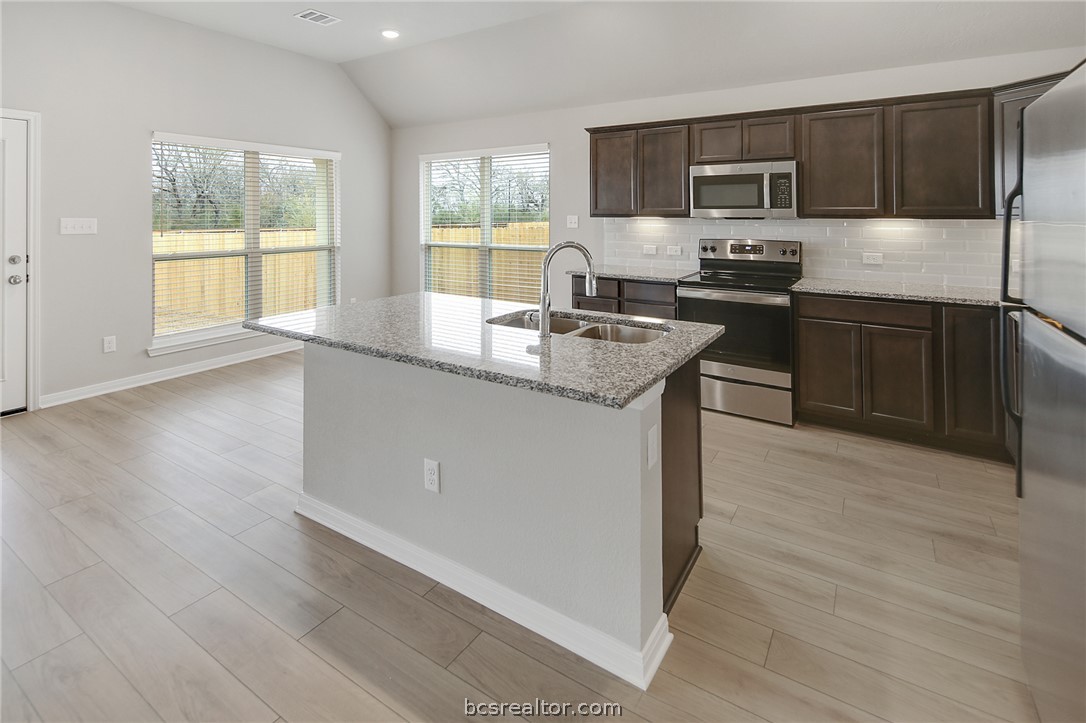 10603 Natural Pond Road College Station, TX 77845 - Photo 11 of 33 kitchen with eating bar and dining area