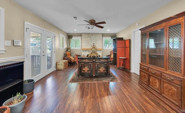 a large kitchen with a table and chairs