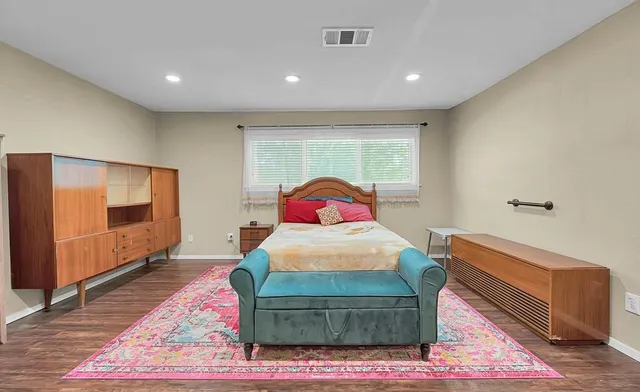 a living room with furniture a window and a fireplace