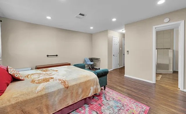 a room with a bed and a rug