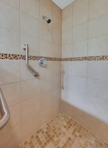 a bathroom with a sink double vanity and a mirror