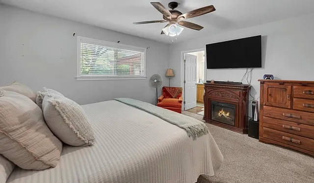 a bedroom with a bed and window