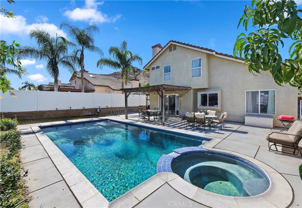 4144 Shellicia Circle Riverside, CA 92509 - Photo 1 of 33 a view of swimming pool with outdoor seating