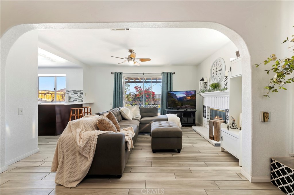 4144 Shellicia Circle Riverside, CA 92509 - Photo 18 of 33 a living room with furniture and a flat screen tv