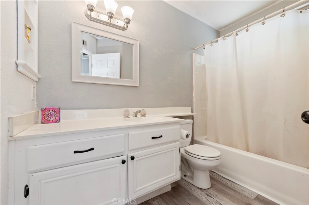4144 Shellicia Circle Riverside, CA 92509 - Photo 24 of 33 a bathroom with a sink a toilet and shower