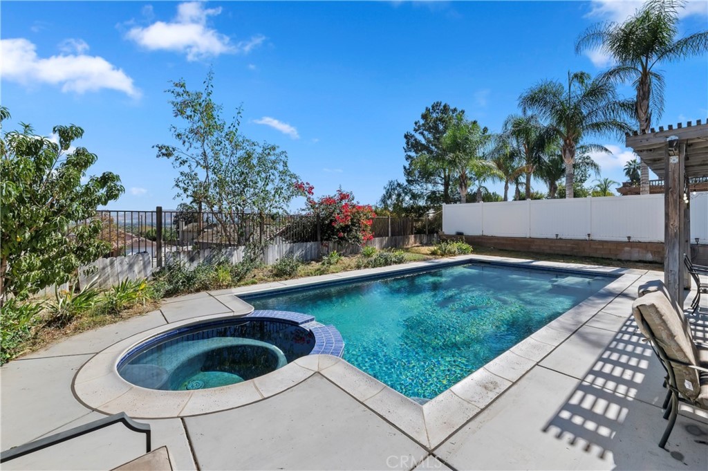 4144 Shellicia Circle Riverside, CA 92509 - Photo 32 of 33 a view of swimming pool and lake view