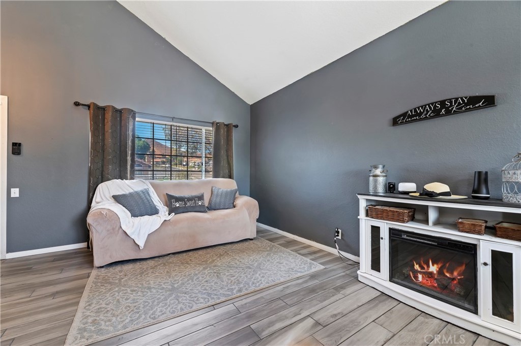 4144 Shellicia Circle Riverside, CA 92509 - Photo 7 of 33 a living room with furniture and a fireplace